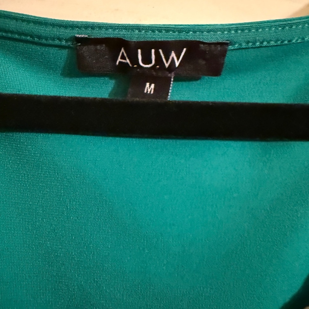 Green blouse with gold neckline